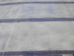 Circles & Borders Stamped Concrete with grey broom concrete